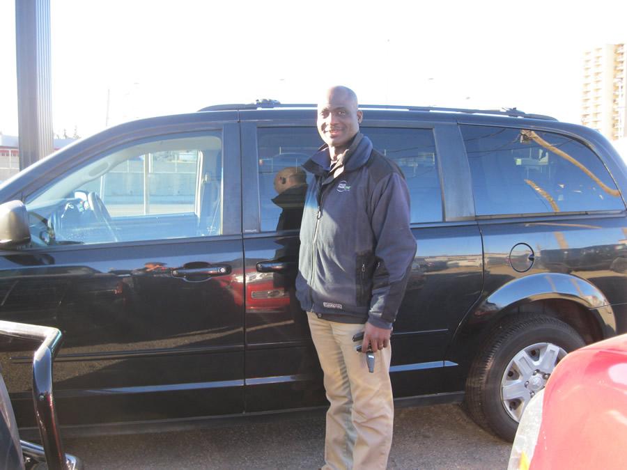 Abraham with his new Dodge Caravan