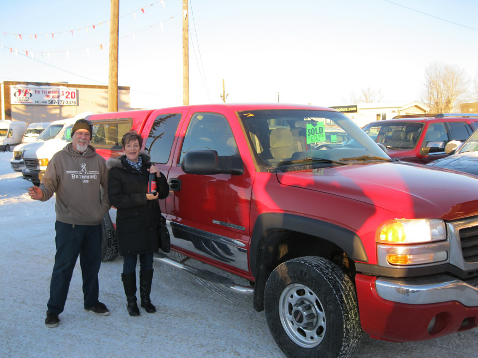 Jane and her new GMC Sierra